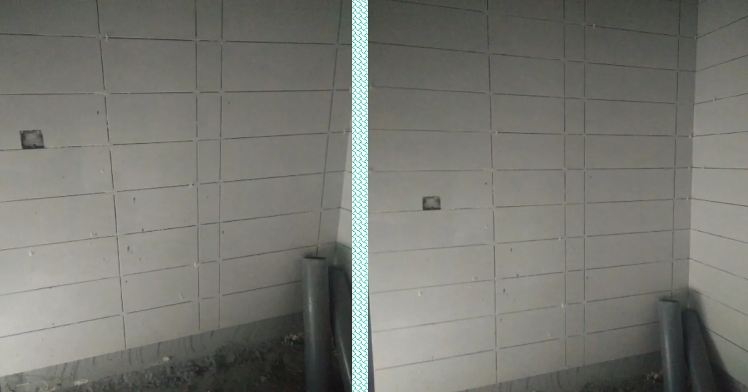 Two similar views of a bare wall lined with large grey panels, with a socket cut-out and grey pipes at its foot.