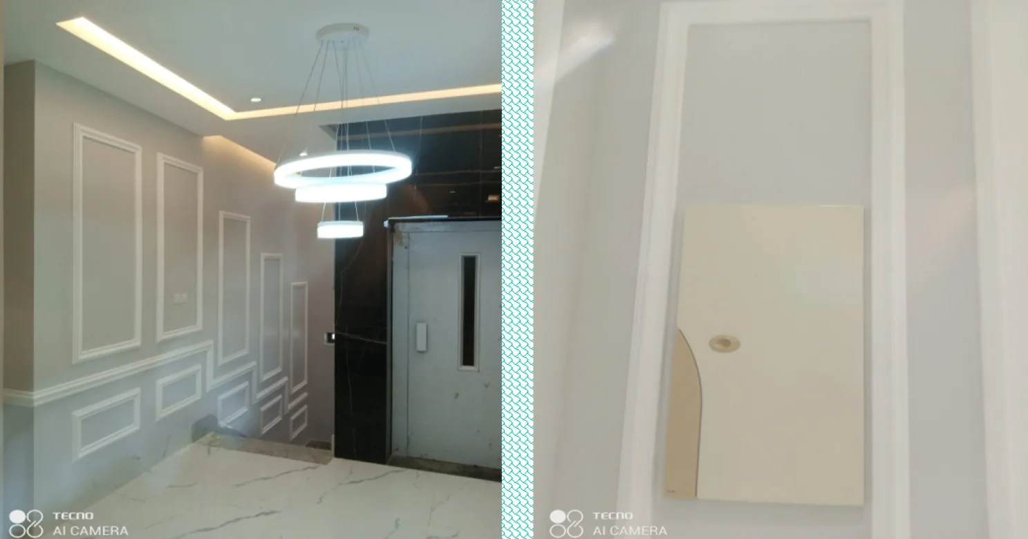 Left, lift lobby with cove-lit ceiling, ring pendant and black marble lift surround; right, close-up of a moulded wall panel.